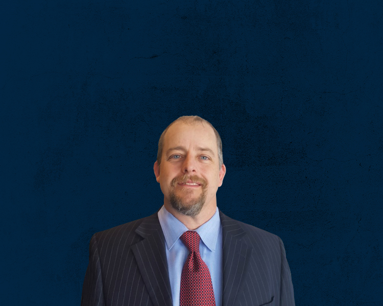Steven M. Sweat with a blue background